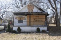 An abandoned house a block from Hope City where we serve