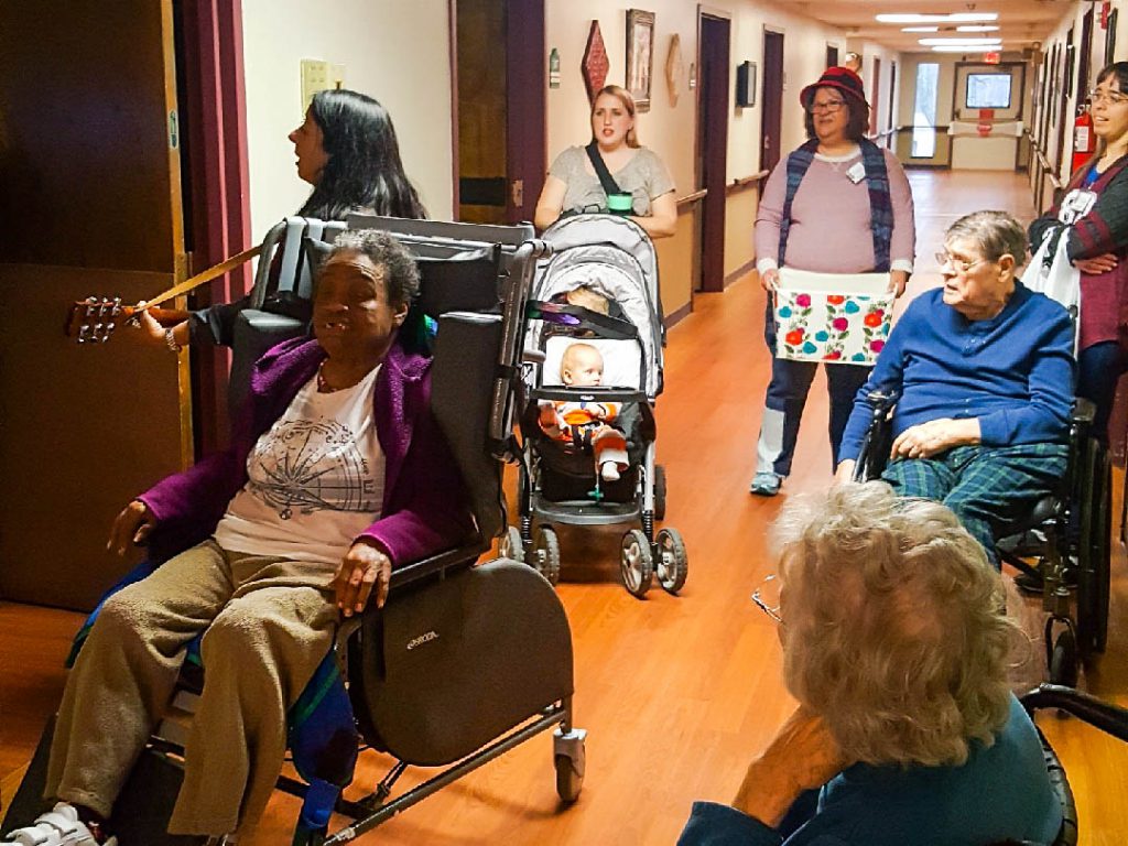 Thursday before Christmas break, we took some of our Anna Club members around the hallways of the nursing home to sing Christmas Carols to each room.