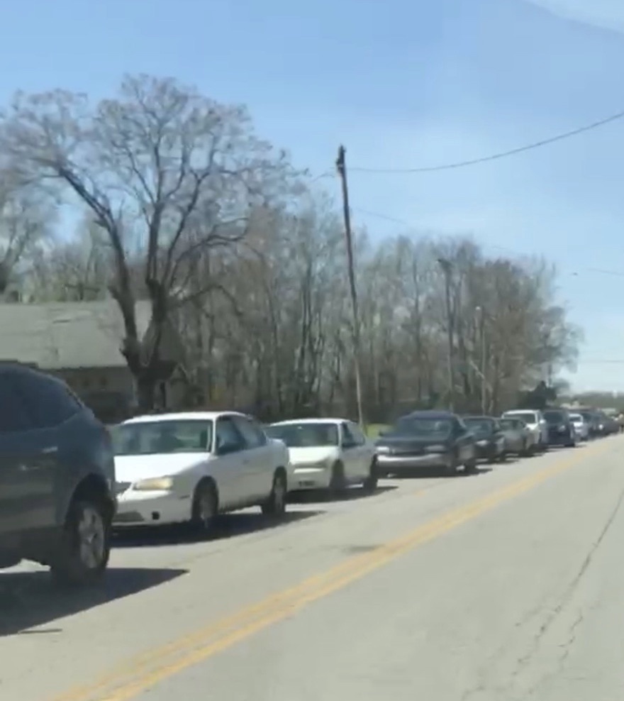 Cars line up many blocks to receive help from Hope City during this crisis