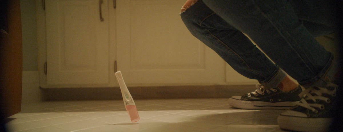 After finding out she is pregnant, Savannah, the pregnant woman drops her pregnancy test.