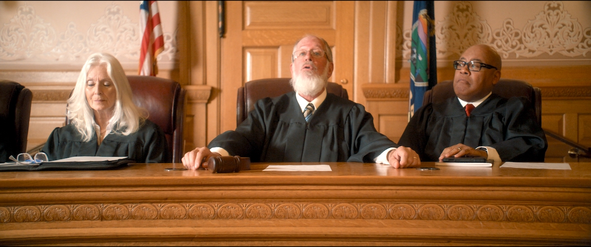 Justice Terrell Williams (right) sits beside pro-life Chief Justice Michael Owens announcing the case