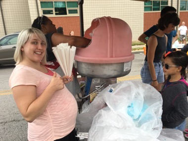 Just a few days before going into labor Theresa helped serve cotton candy to the kids!