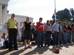 Standing in front of the Supreme Court facing the Senate